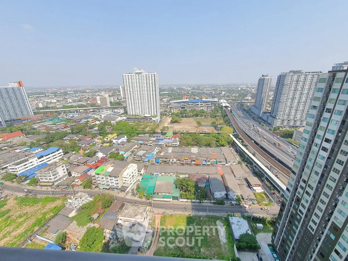 Stunning high-rise cityscape view from a modern apartment balcony, showcasing urban living and expansive skyline.