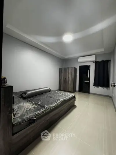 Modern minimalist bedroom with sleek design and neutral tones