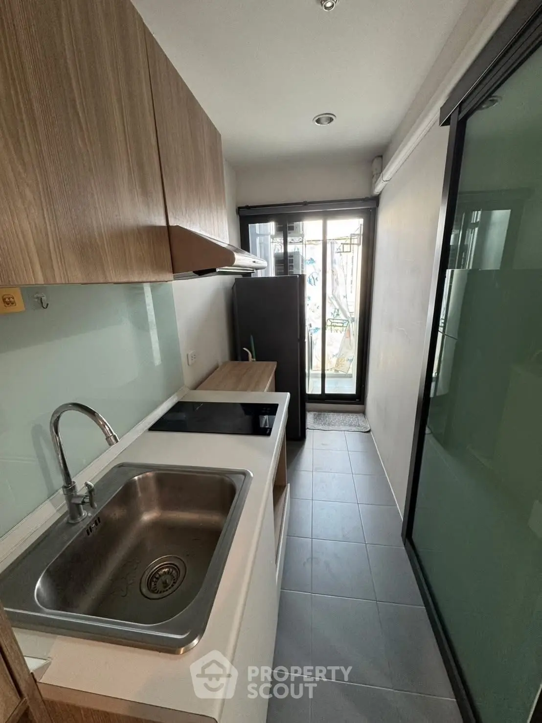 Modern compact kitchen with sleek design and ample storage in urban apartment