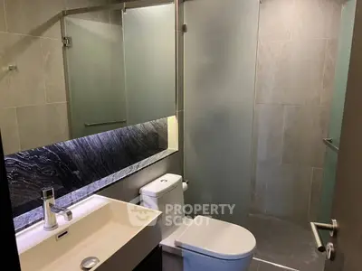 Modern bathroom with sleek design and glass shower enclosure