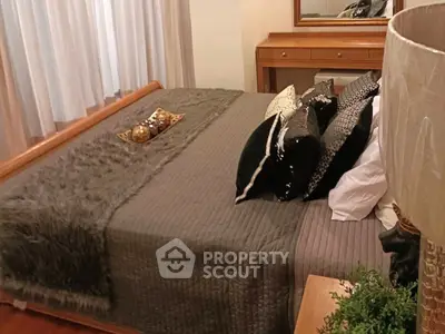 Luxurious bedroom with elegant decor and plush bedding