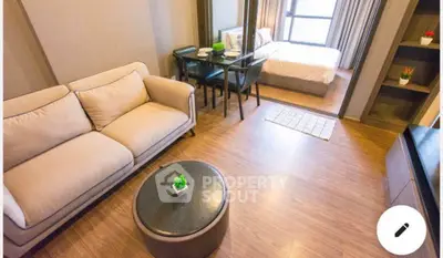 Modern studio apartment with cozy living area and stylish decor