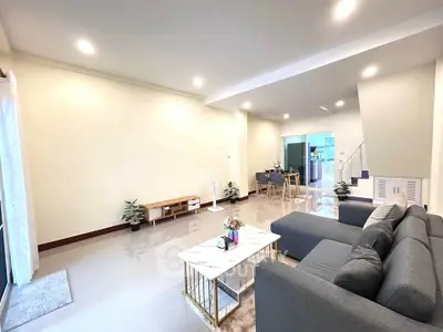 Spacious modern living room with elegant decor and ample natural light