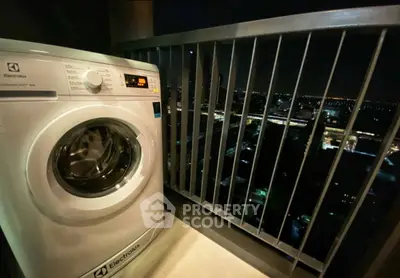 Modern balcony with washing machine and stunning night city view