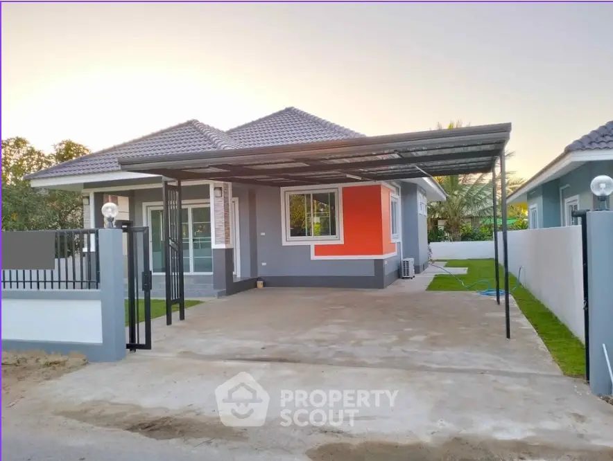 Charming single-story home with modern design and spacious driveway in a serene neighborhood.