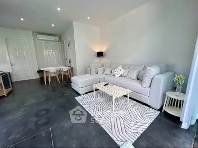 Spacious modern living room with stylish decor and cozy seating area