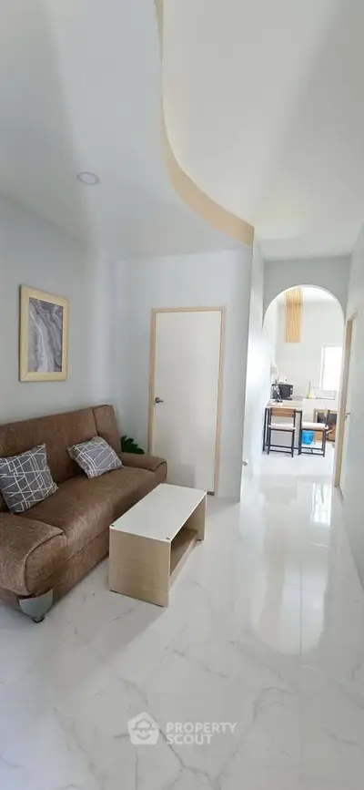 Modern living room with sleek design and cozy furniture