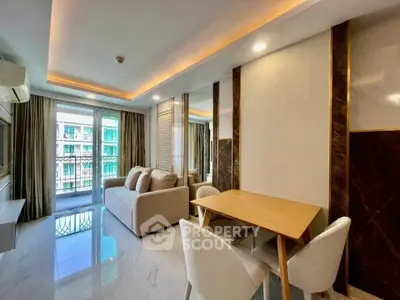 Modern living room with elegant decor and balcony view, featuring stylish furniture and ambient lighting.