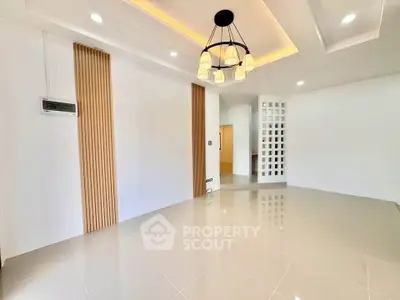 Modern living room with elegant lighting and sleek tile flooring