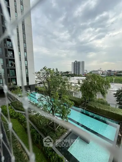 Modern apartment building with stunning pool and city view