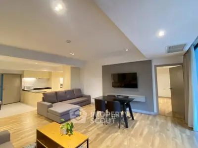 Spacious modern living room with open kitchen and stylish decor