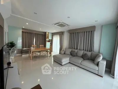 Spacious modern living room with elegant decor and large windows