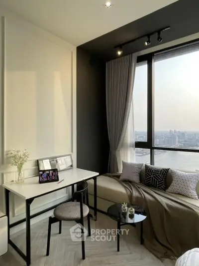 Modern living room with panoramic city view, stylish decor, and cozy seating area.