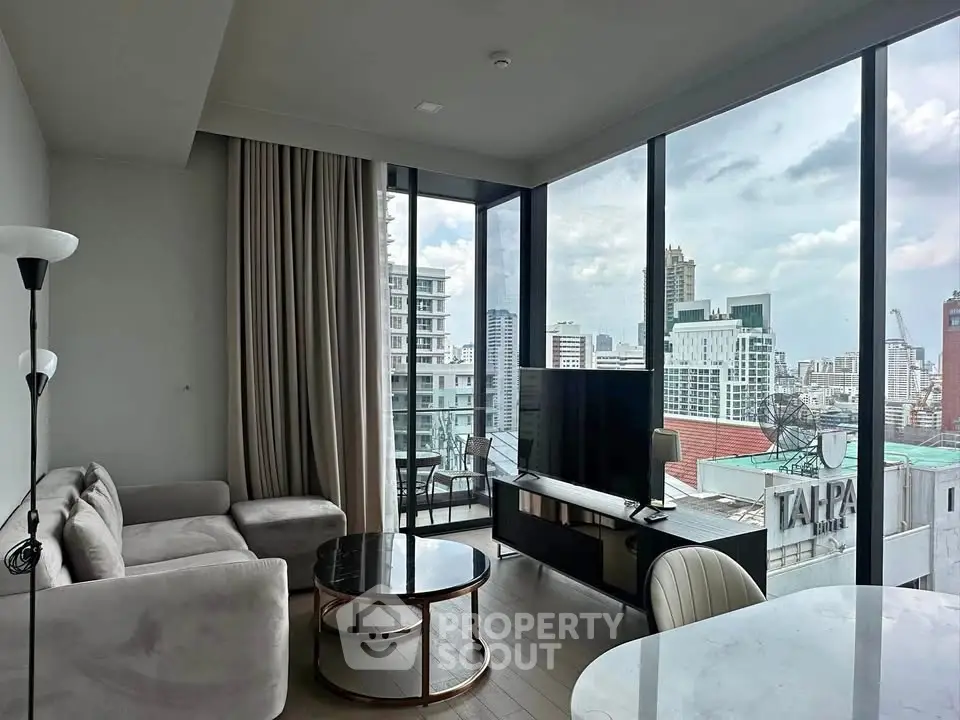 Modern living room with panoramic city view and stylish furniture