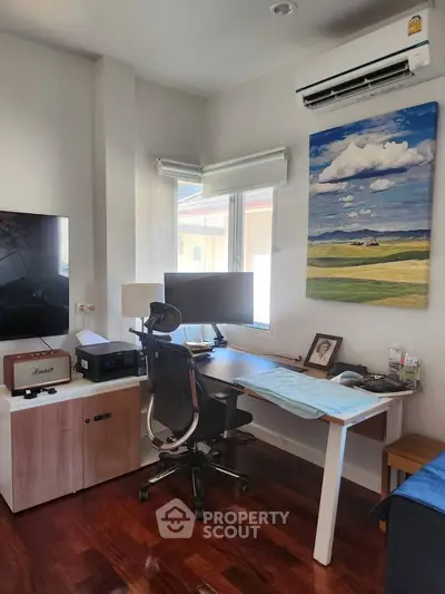 Modern study room with sleek desk, chair, and large window view.