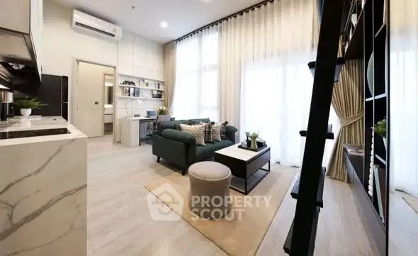 Modern living room with high ceilings and elegant decor in a stylish apartment.