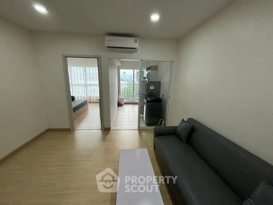 Modern living room with sleek sofa and balcony view