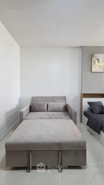 Modern living room with stylish sofa bed and minimalist decor
