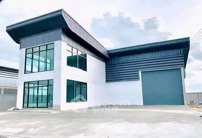 Modern industrial warehouse with large windows and spacious loading area