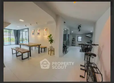 Spacious modern living area with stylish decor and natural light