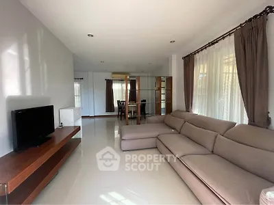 Spacious living room with modern sofa and natural light