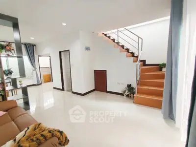 Spacious modern living room with staircase and elegant decor