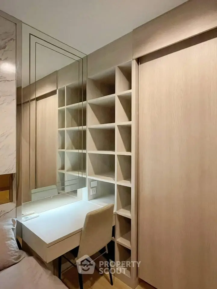 Modern study nook with built-in shelves and sleek design in a contemporary apartment.