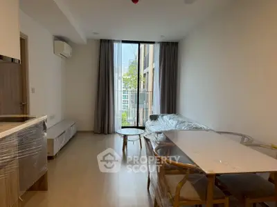 Modern living room with balcony and stylish furniture in a bright apartment