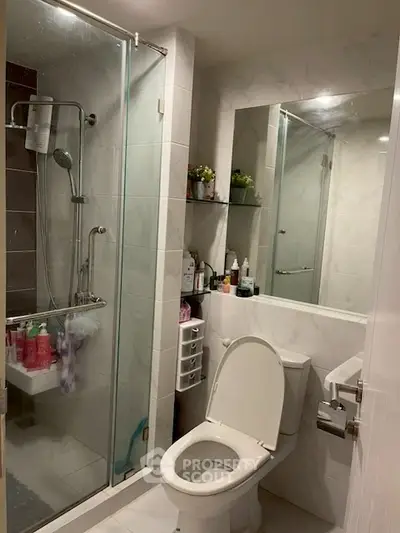 Modern bathroom with glass shower and sleek fixtures