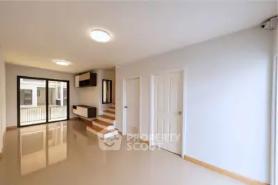 Spacious modern living room with sleek design and natural light