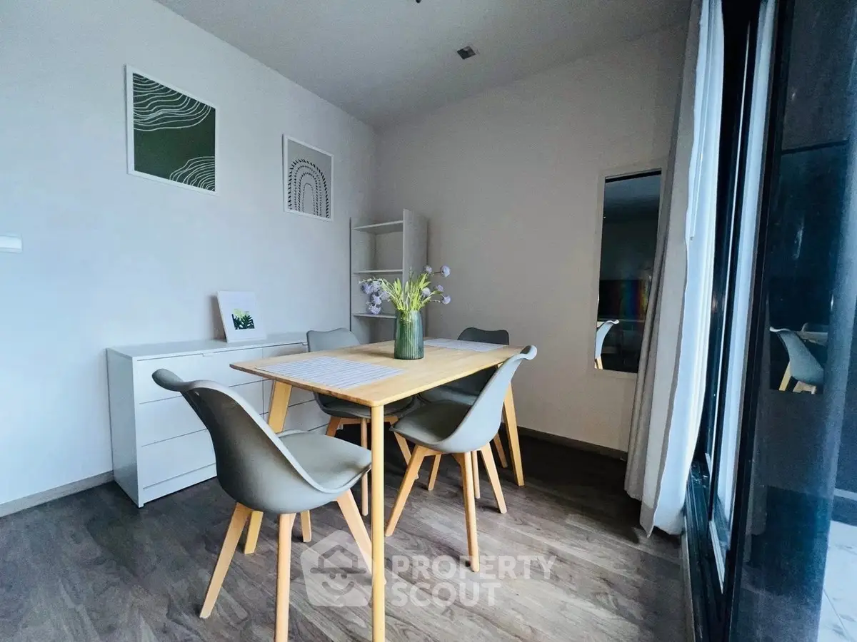 Modern dining area with stylish chairs and wooden table, perfect for cozy meals and gatherings.