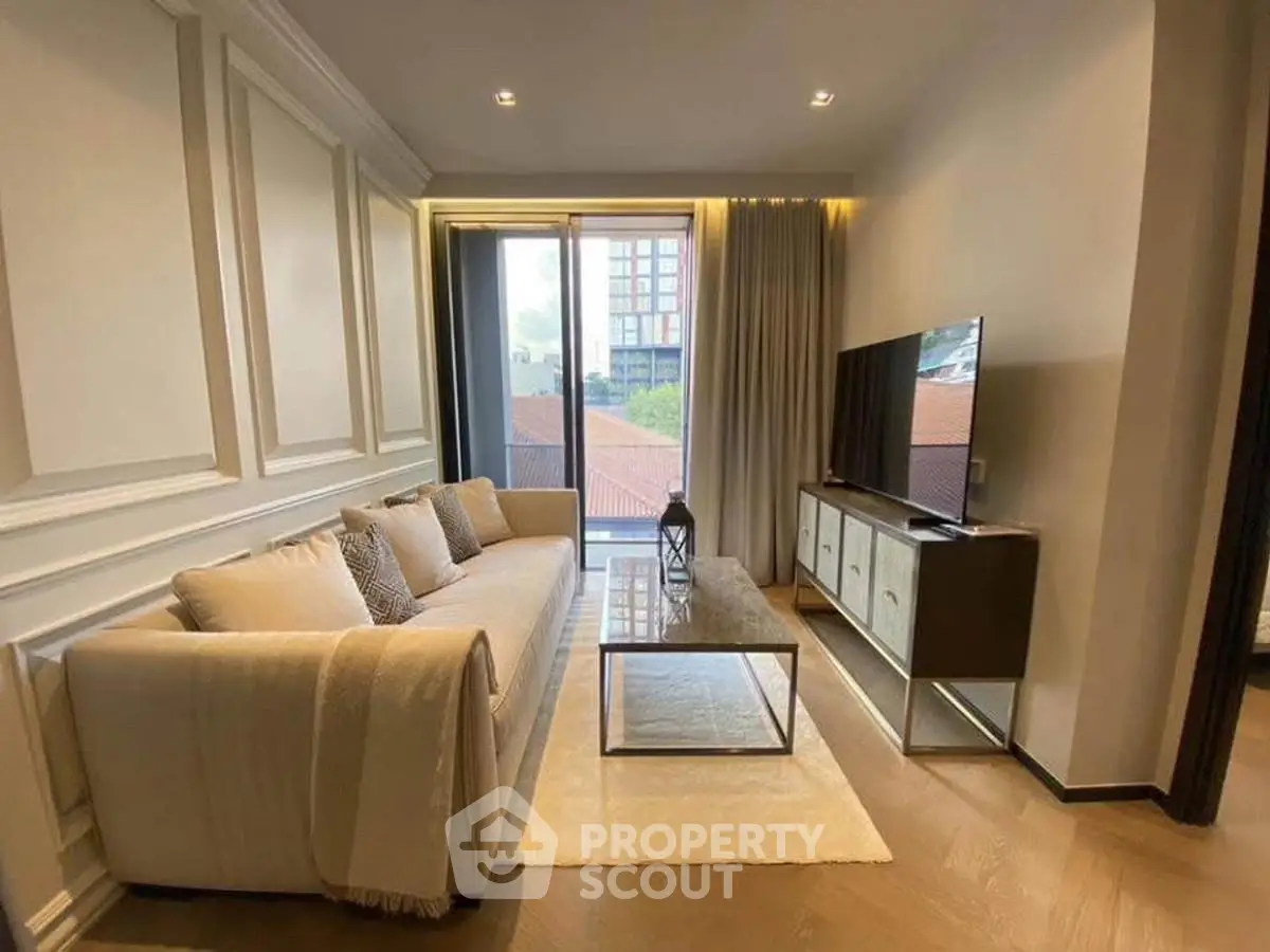 Elegant living room with modern decor and large window view