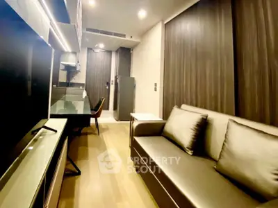 Modern living room with sleek design and cozy seating in a contemporary apartment.