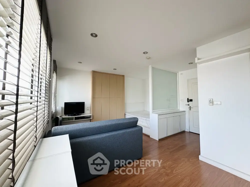 Modern studio apartment with sleek design and ample natural light