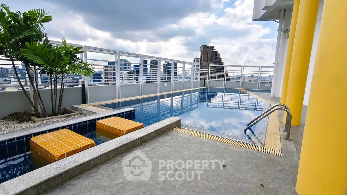 Stunning rooftop pool with city skyline views and modern design.
