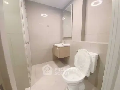 Modern bathroom with sleek fixtures and neutral tiles