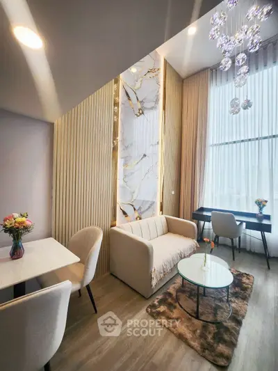 Luxurious modern living room with high ceilings, elegant decor, and natural light