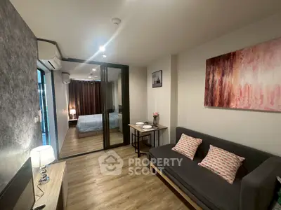 Modern apartment interior with cozy living room and stylish bedroom view.