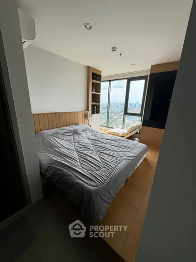 Modern bedroom with panoramic city view and cozy wooden accents