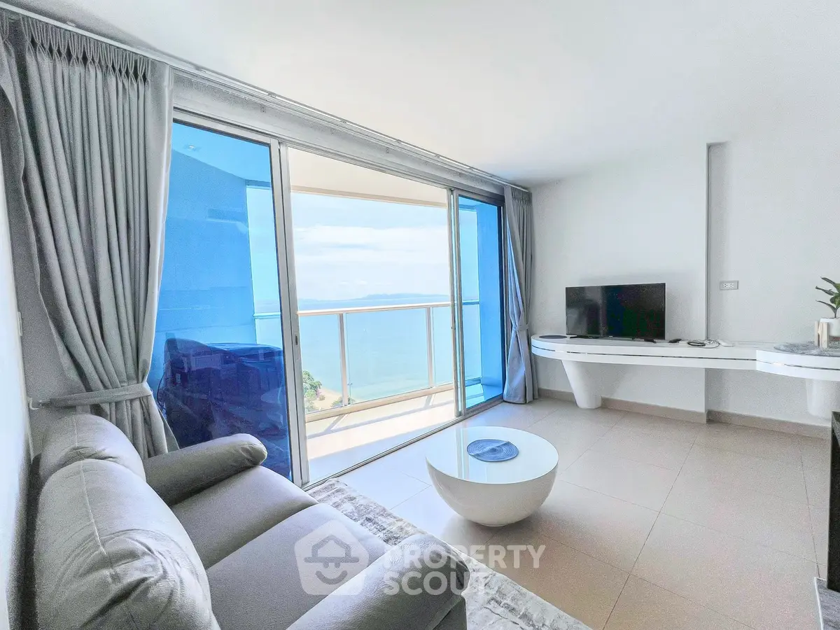 Modern living room with ocean view and sleek furniture
