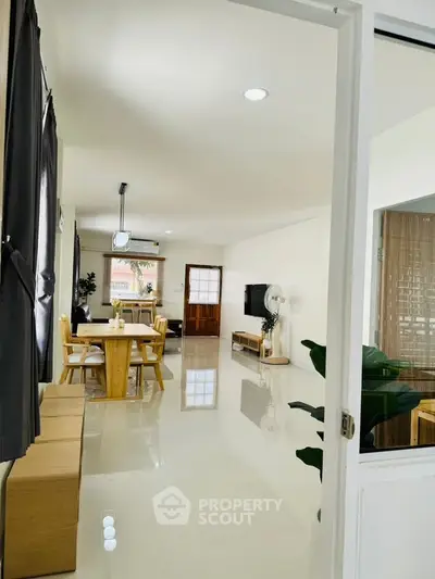 Spacious modern living room with dining area and sleek furnishings