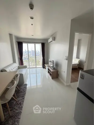 Modern living room with city view, sleek furniture, and natural light