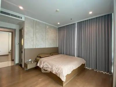 Modern bedroom with elegant design and floor-to-ceiling curtains