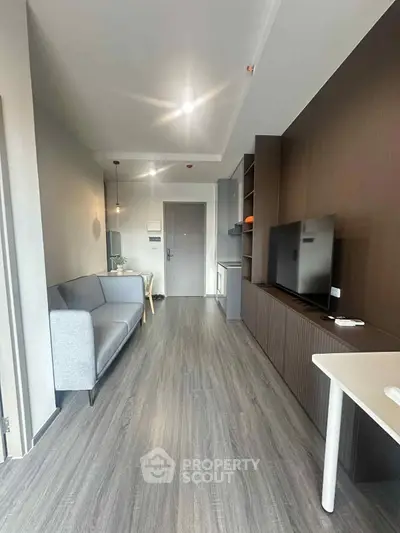 Modern living room with sleek design and stylish furniture in a contemporary apartment.