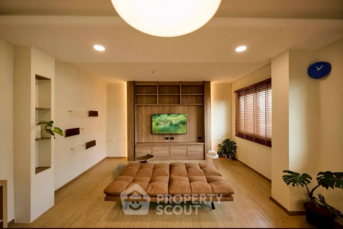 Spacious living room with modern decor and cozy seating area