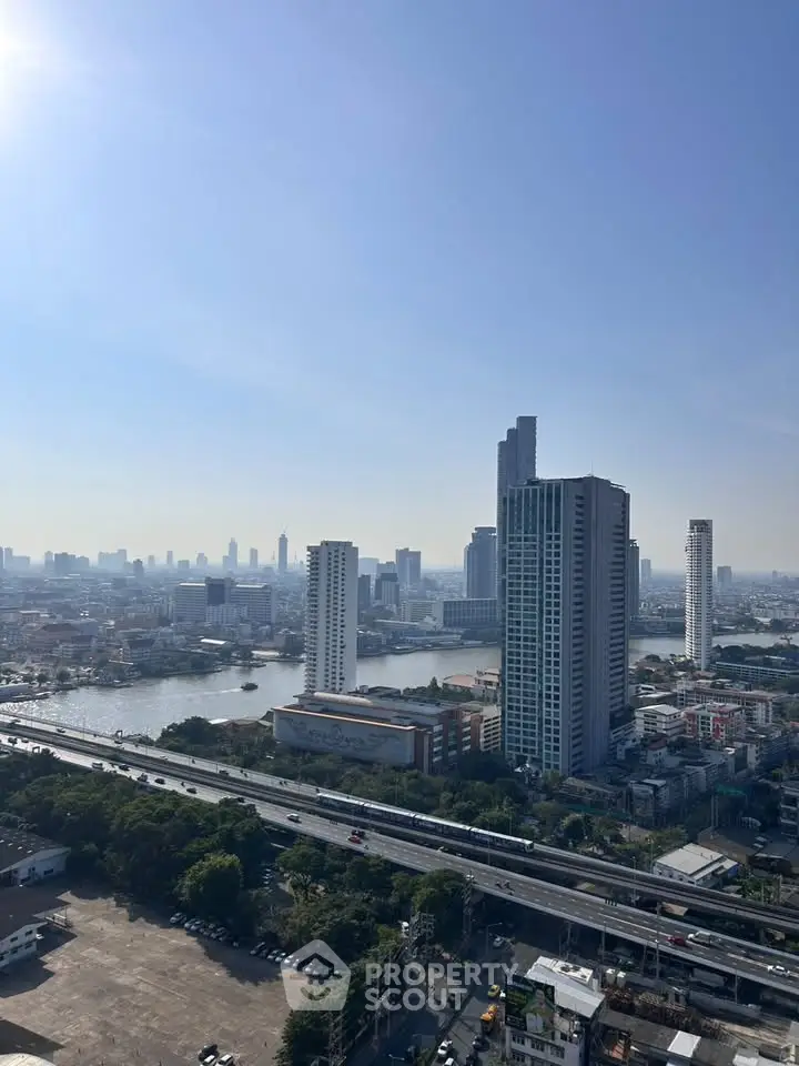 Stunning cityscape view showcasing modern high-rise buildings and a serene river.