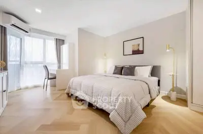 Spacious modern bedroom with elegant decor and natural light
