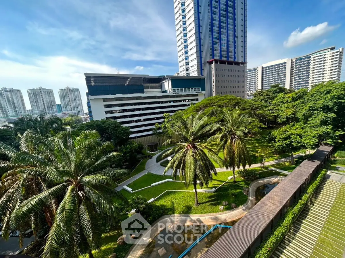 Stunning urban garden view with lush greenery and modern high-rise buildings.