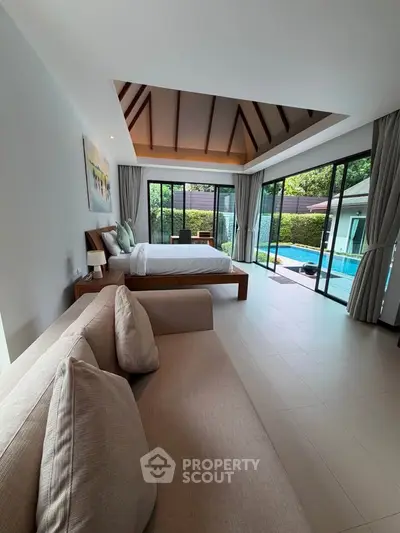 Luxurious bedroom with pool view and modern design