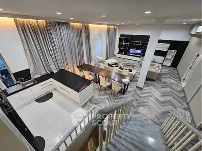 Spacious modern living room with open kitchen and elegant dining area